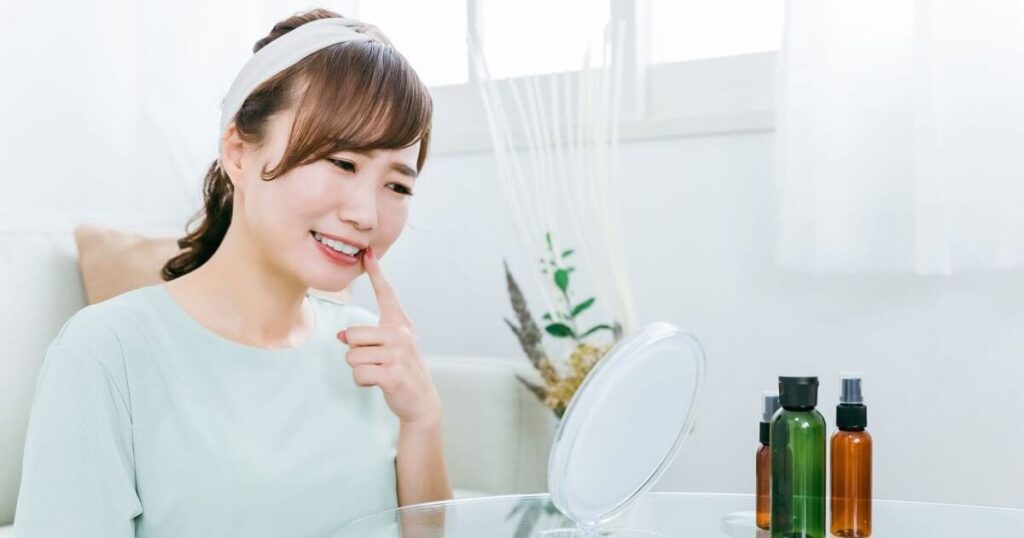 前歯のラミネートべニアを後悔して悲しむ女性